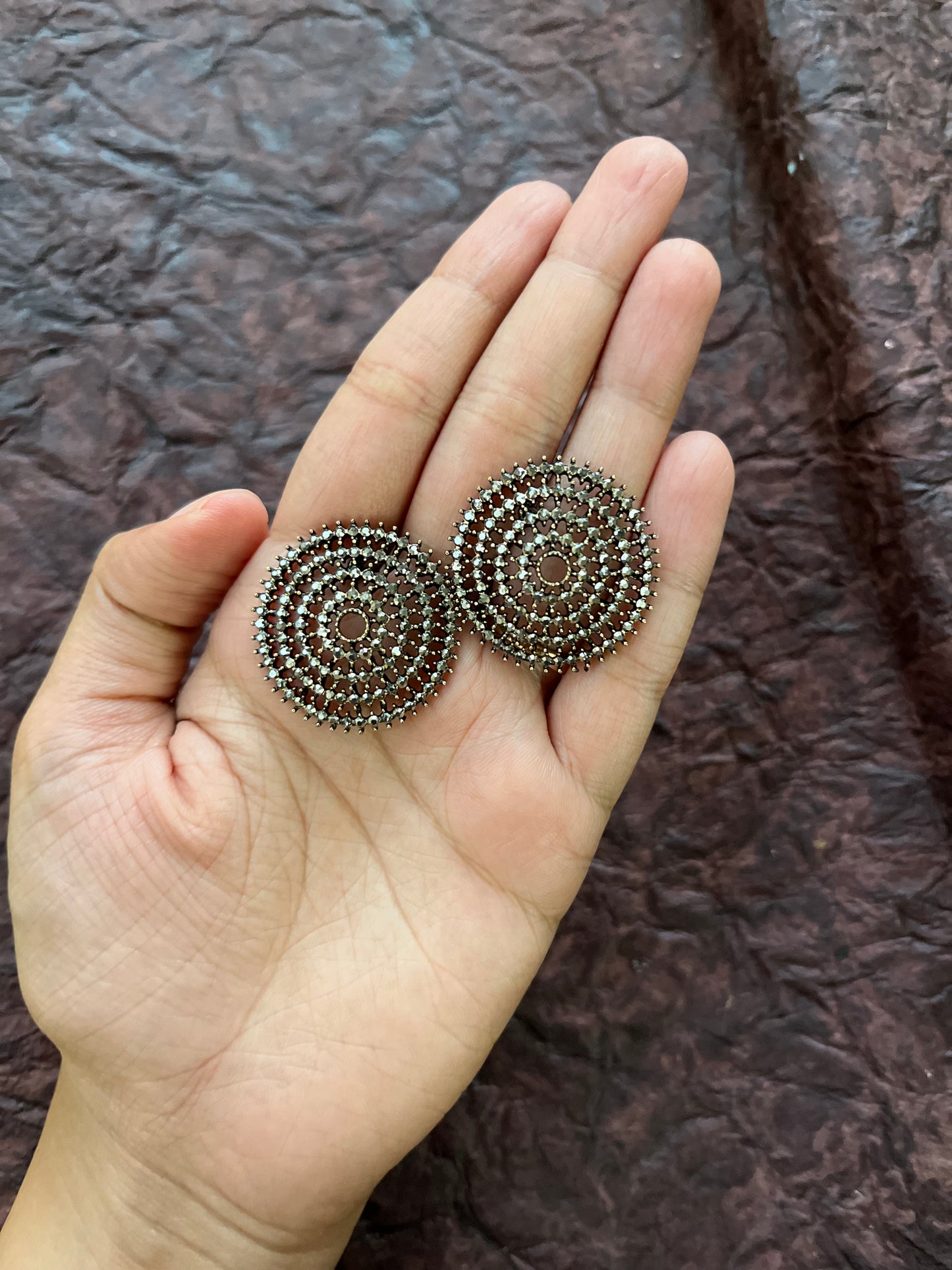 Dual tone statement studs